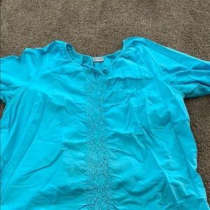 A royal blue blouse with draw strings in the front